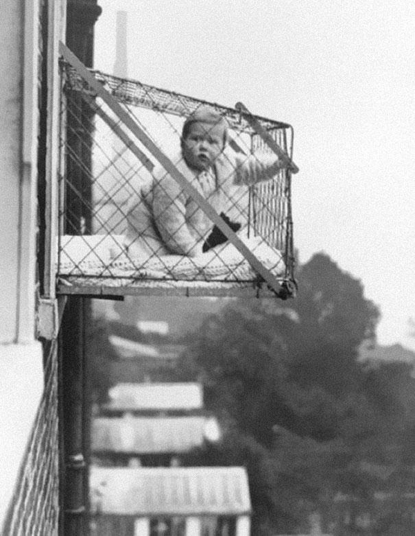 12-Baby-cages-used-to-ensure-that-children-get-enough-sunlight-and-fresh-air-when-living-in-an-apartment-building-ca-1937