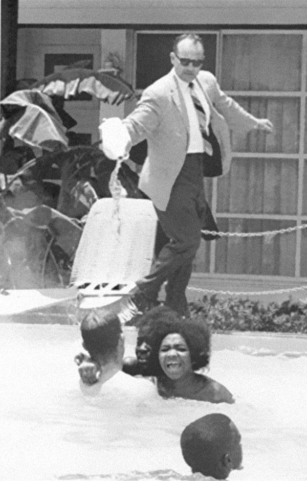 25-Hotel-owner-pouring-acid-in-the-pool-while-black-people-swim-in-it-ca-1964